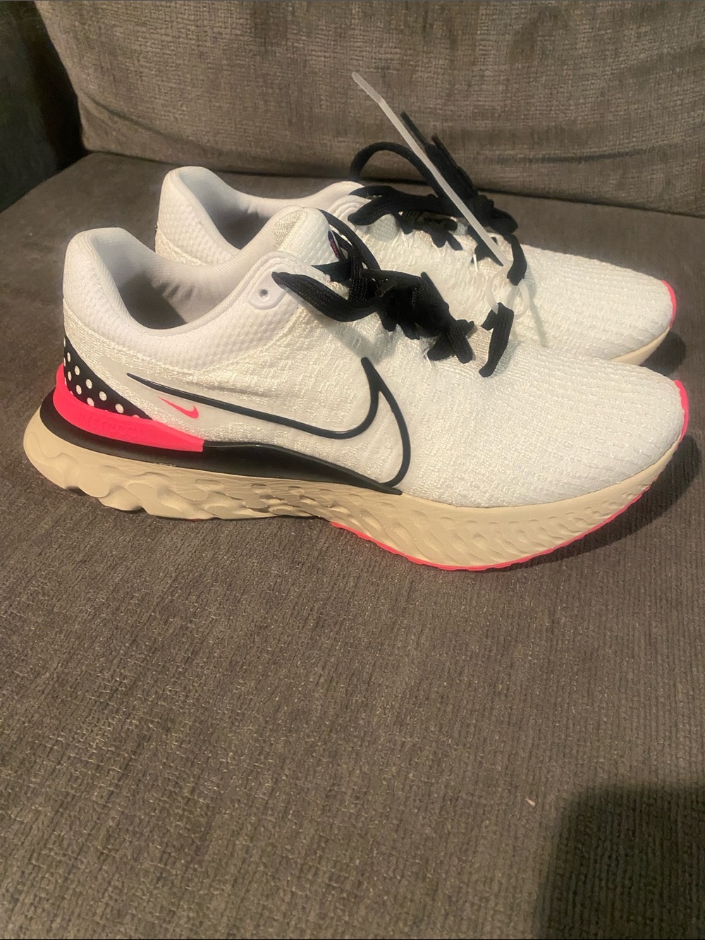 Nike Women’s White Running Shoes with Black and Pink Accents